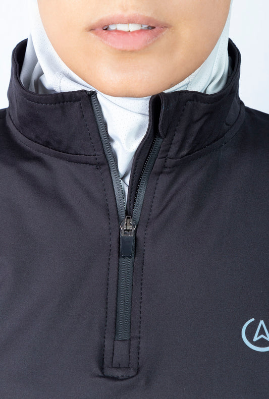 Long gym top. Modest athletic wear top in black. A mid thigh length with long sleeves and collar. Hijab friendly workout clothes.